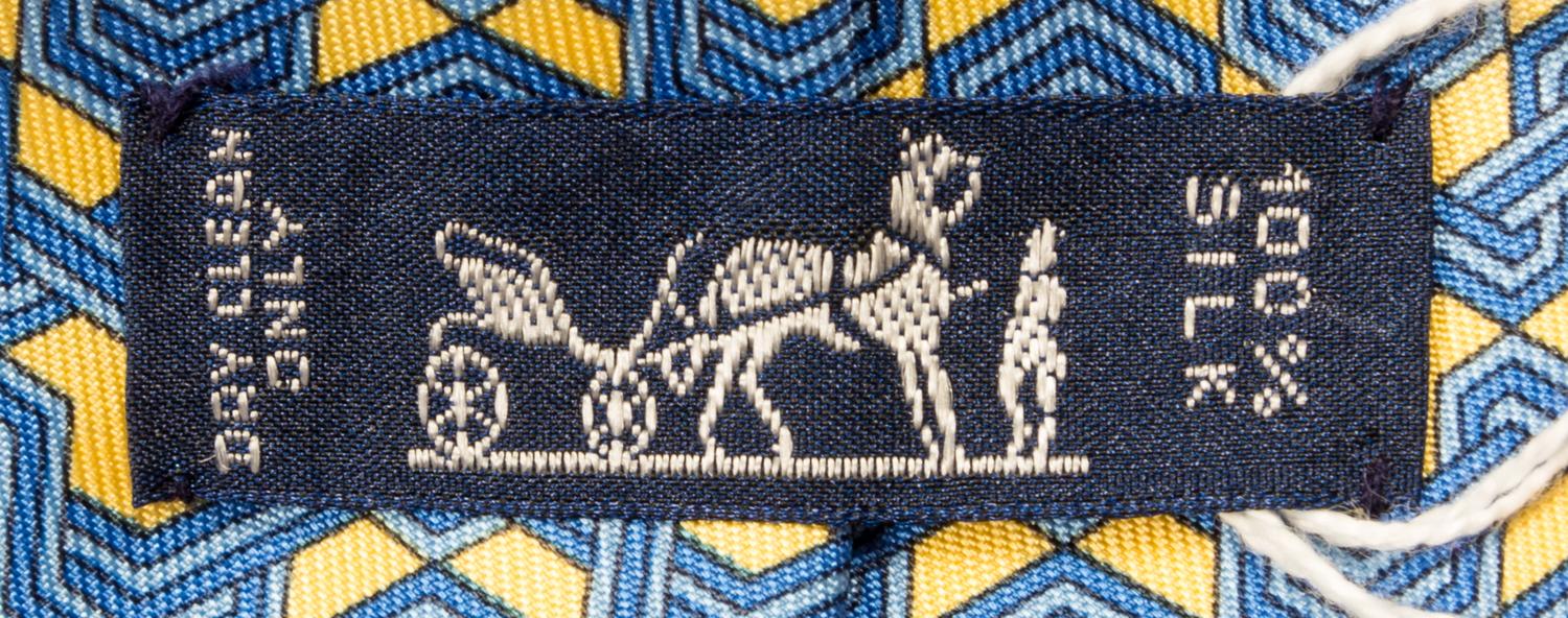 A Group of Three Hermes Silk Ties, 3.15" wide.