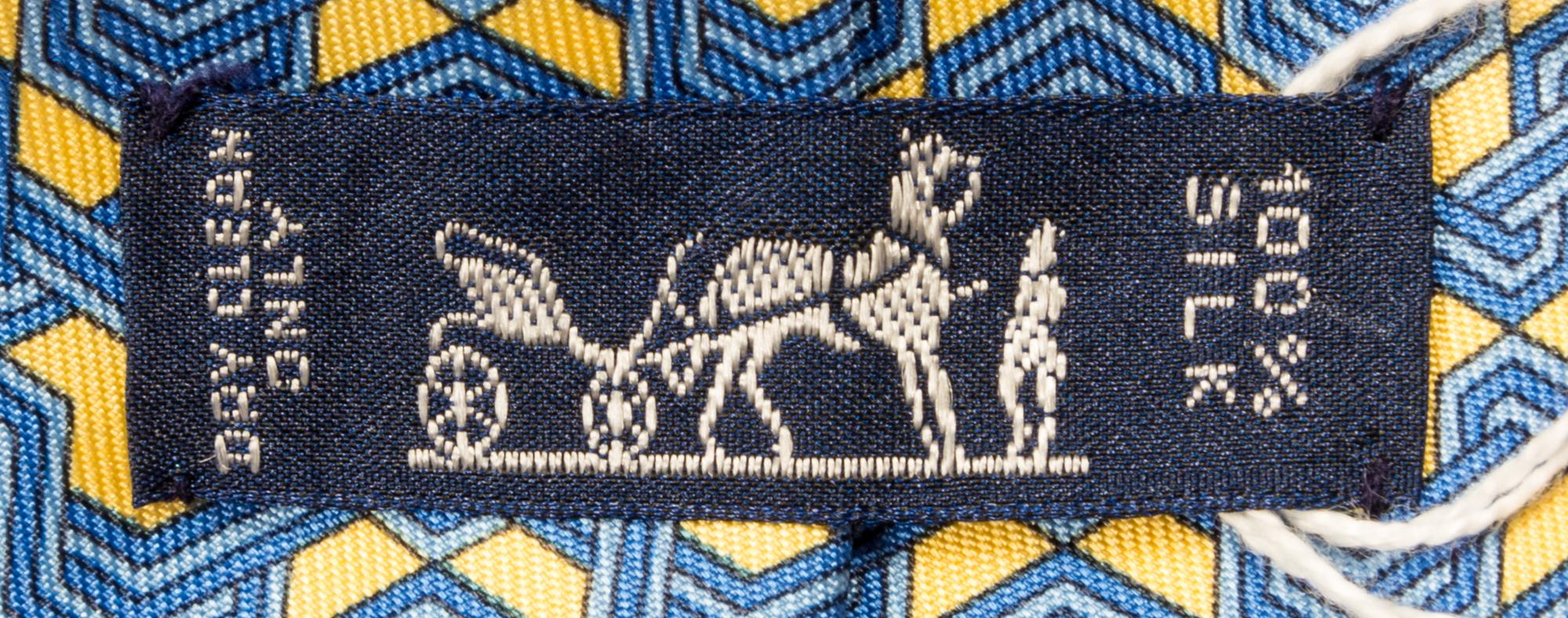 A Group of Three Hermes Silk Ties, 3.15" wide.
