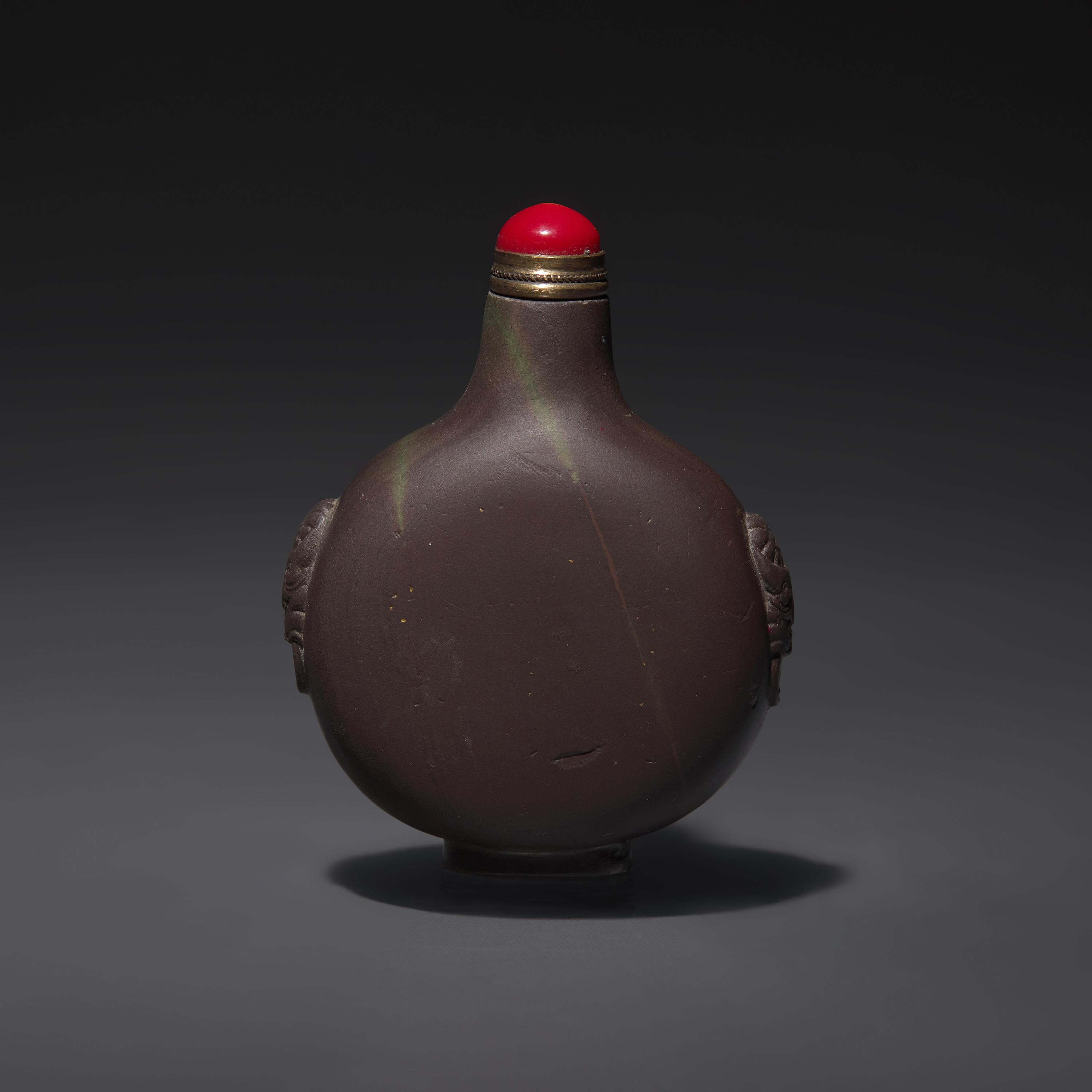 A Chinese Carved Duan Stone Snuff Bottle, Qing Dynasty, Circa 1800-1850 — 1800–1850年 端石雕龍紋鼻煙壺