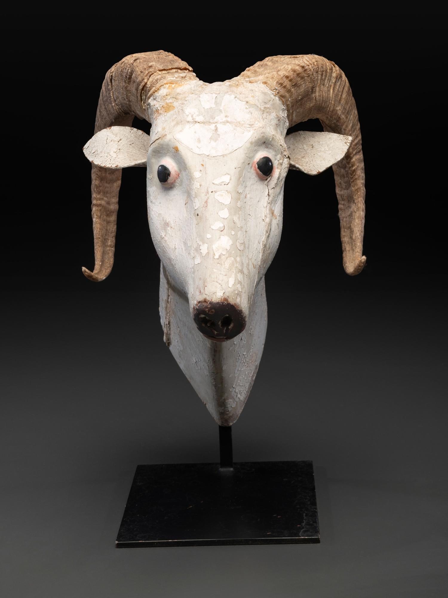 A Folk Art Carved and Painted Wood Ram's Head