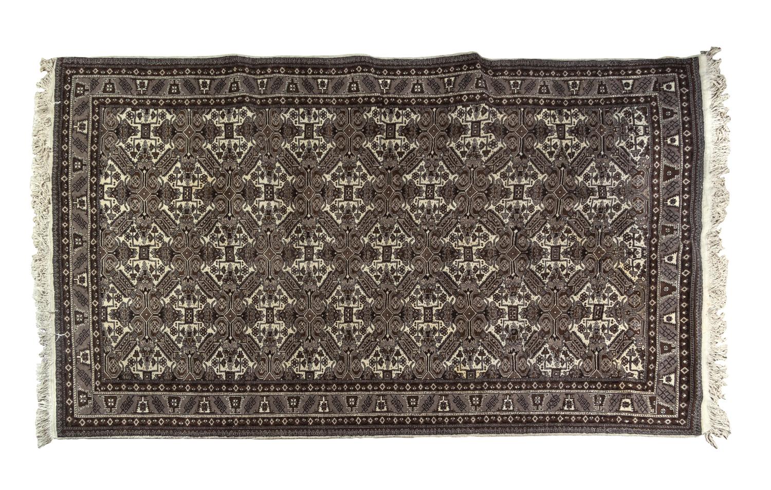 A Bokhara Wool Rug 9 feet 7 inches x 6 feet 6 inches.