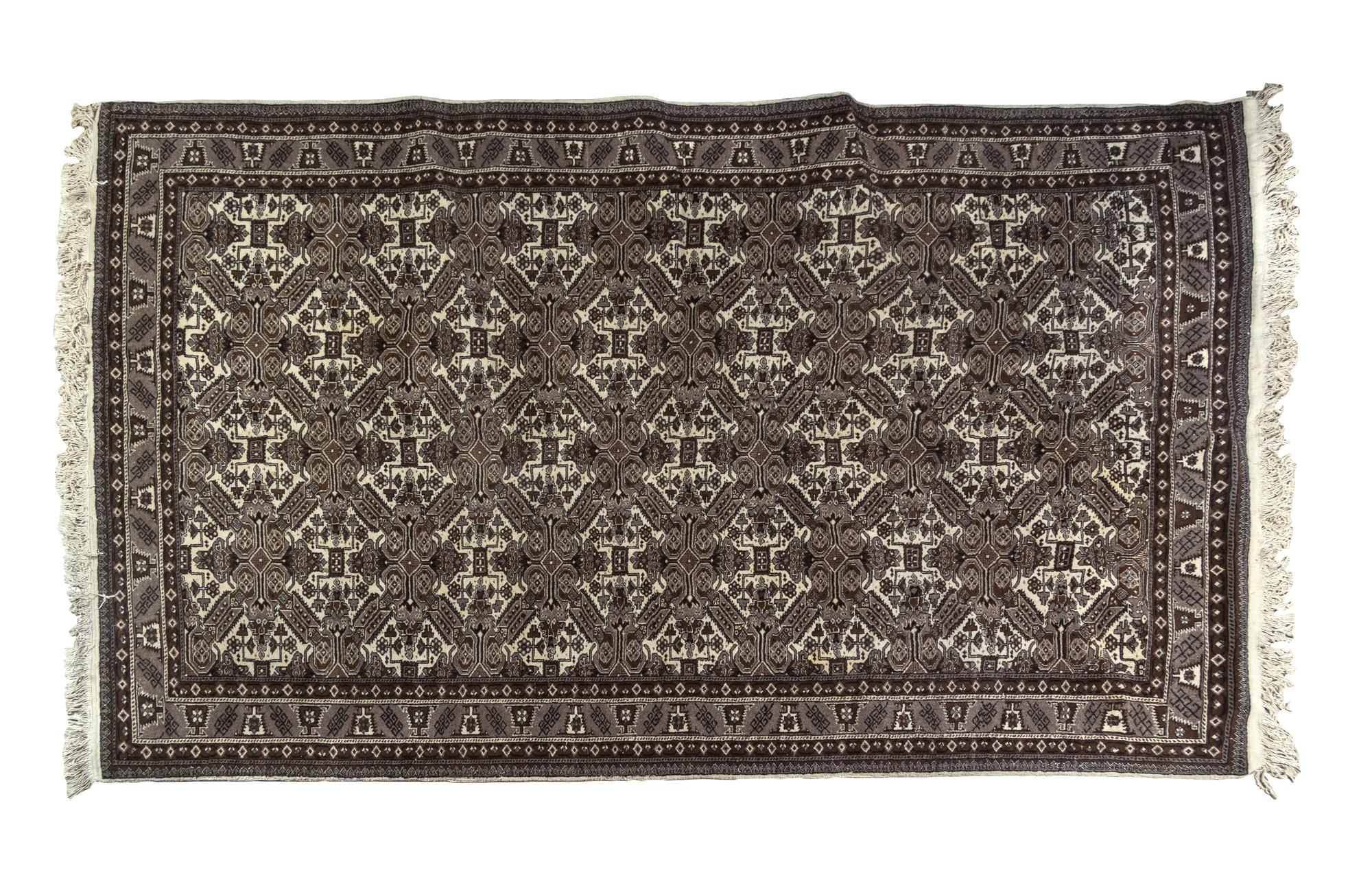 A Bokhara Wool Rug 9 feet 7 inches x 6 feet 6 inches.