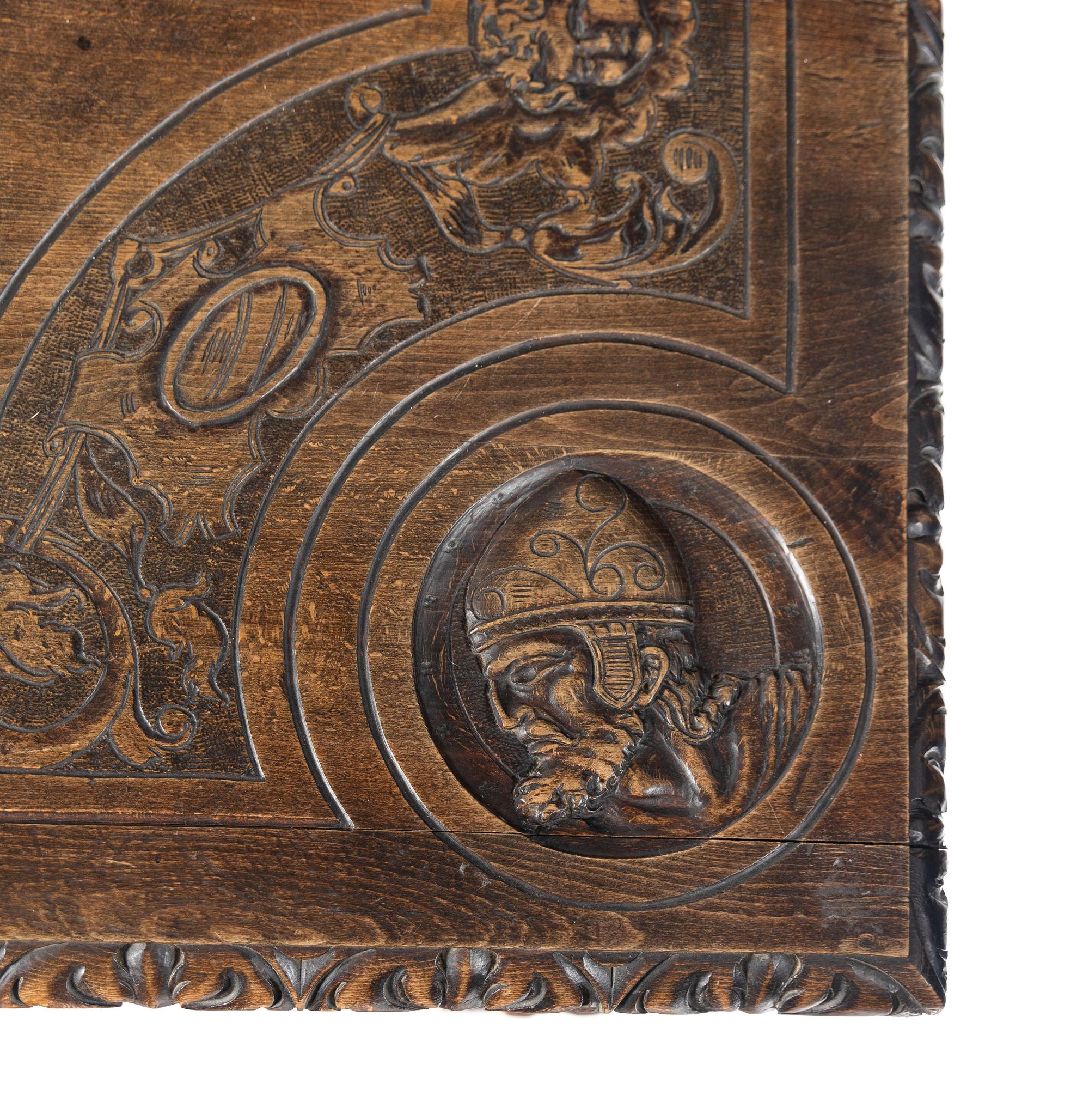 A Renaissance Revival Iron-Mounted Carved Walnut Library Table