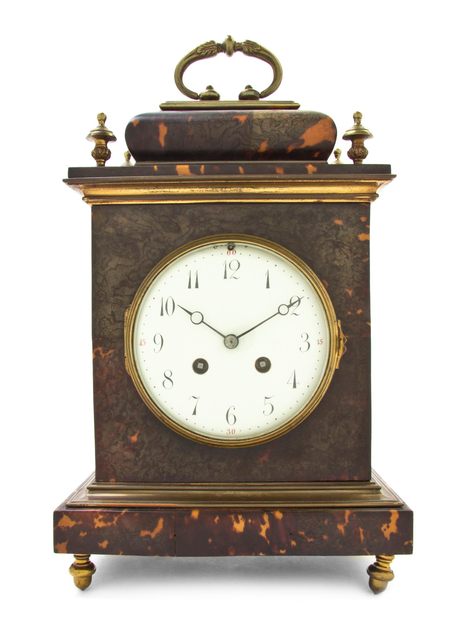 A Continental Tortoise Shell and Brass Mounted Bracket Clock, Height 13 3/8 x width 8 1/2 x depth 5 3/8 inches.
