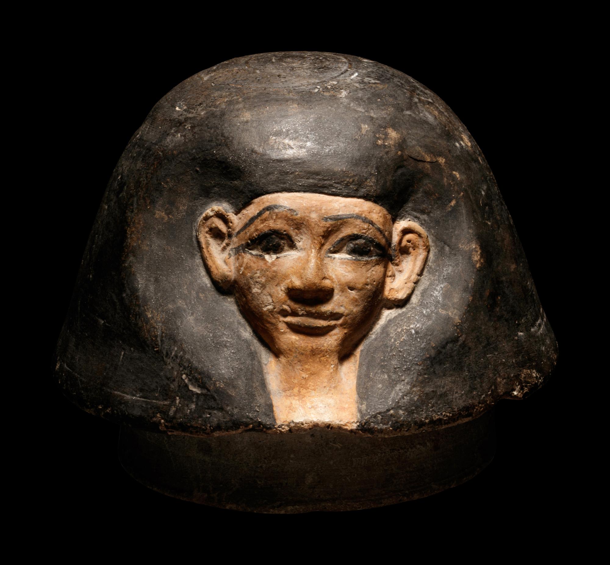 An Egyptian Canopic Jar Lid