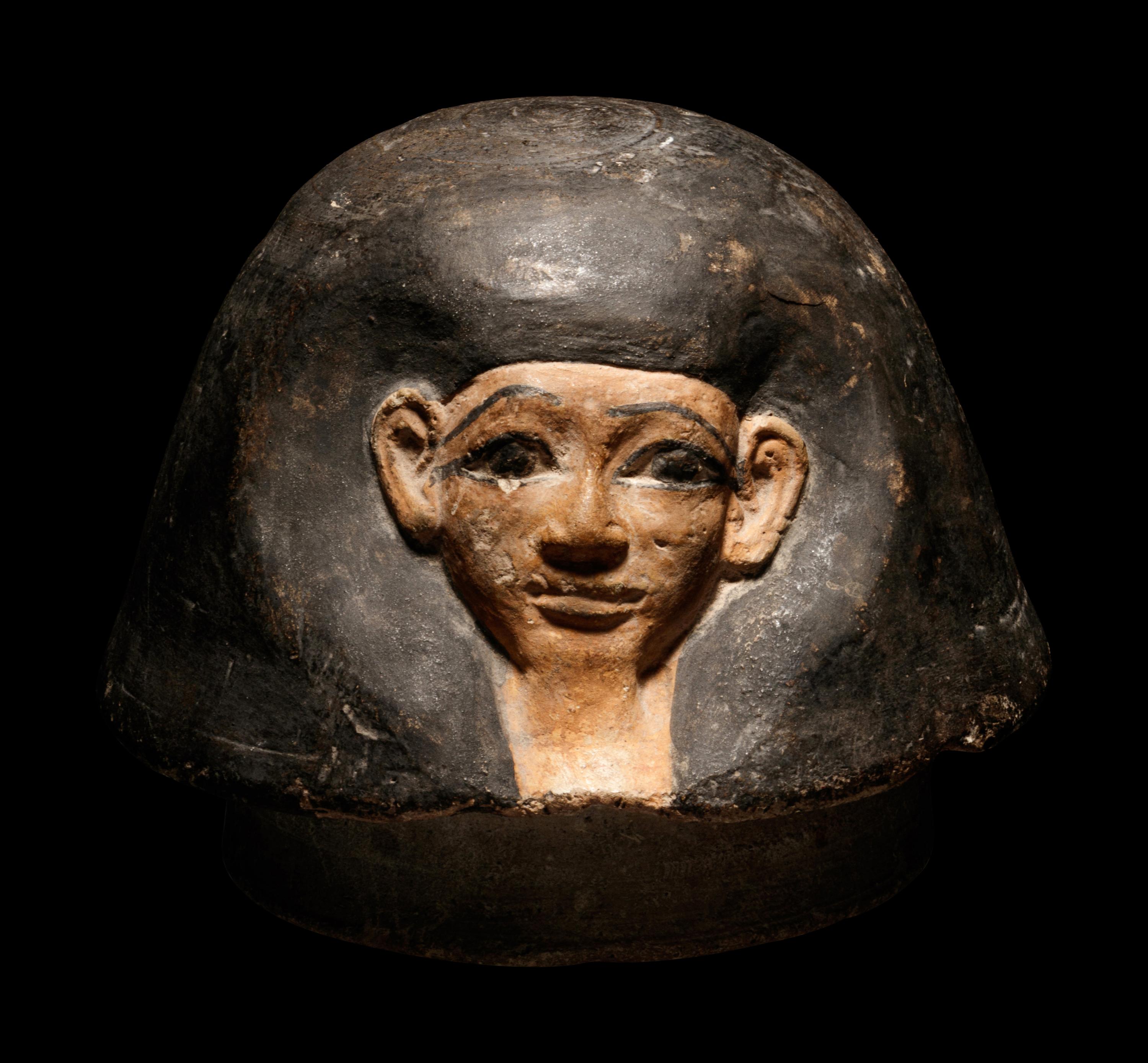 An Egyptian Canopic Jar Lid