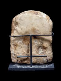 An Egyptian Limestone Round-Top Stele