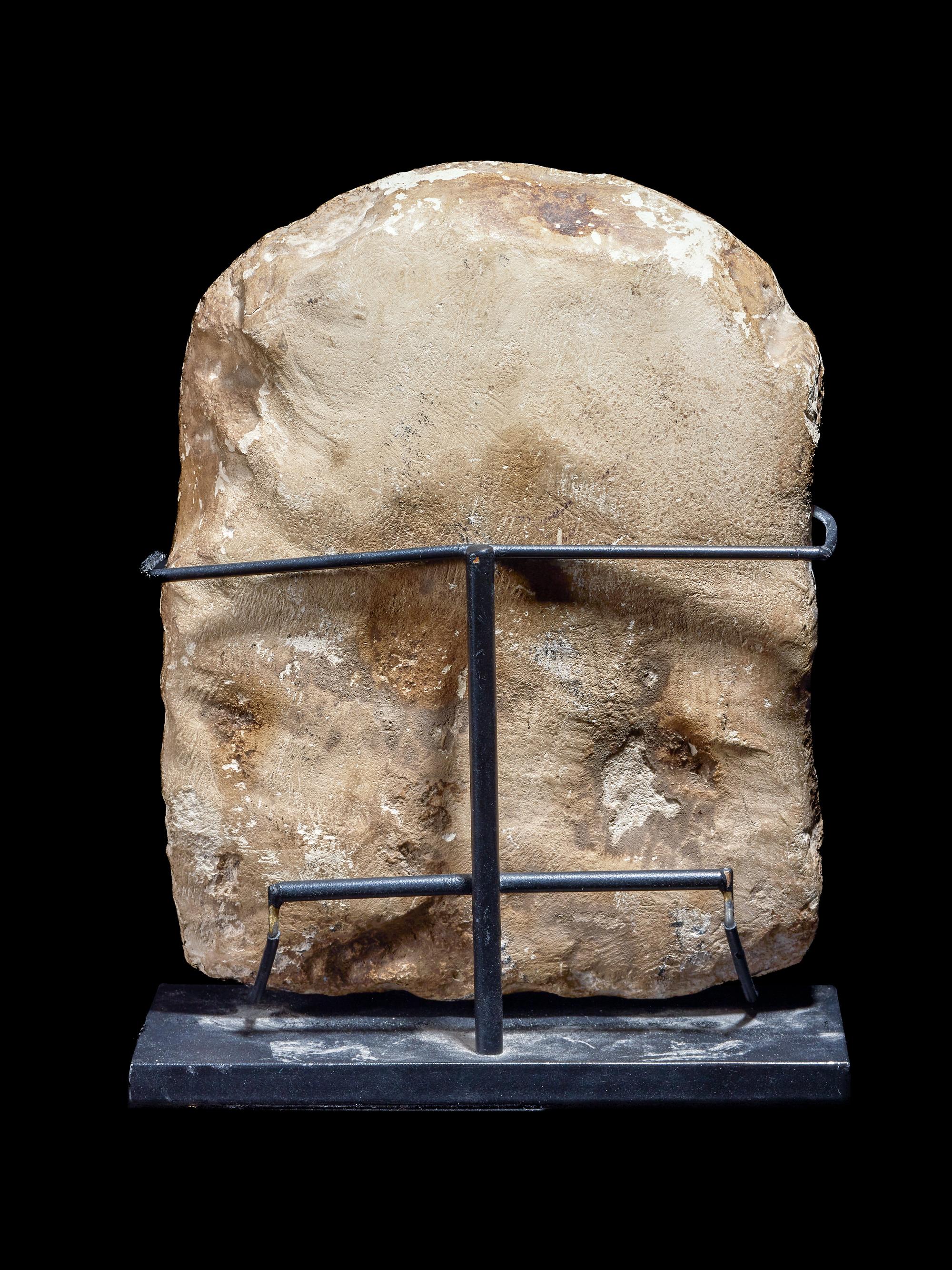 An Egyptian Limestone Round-Top Stele