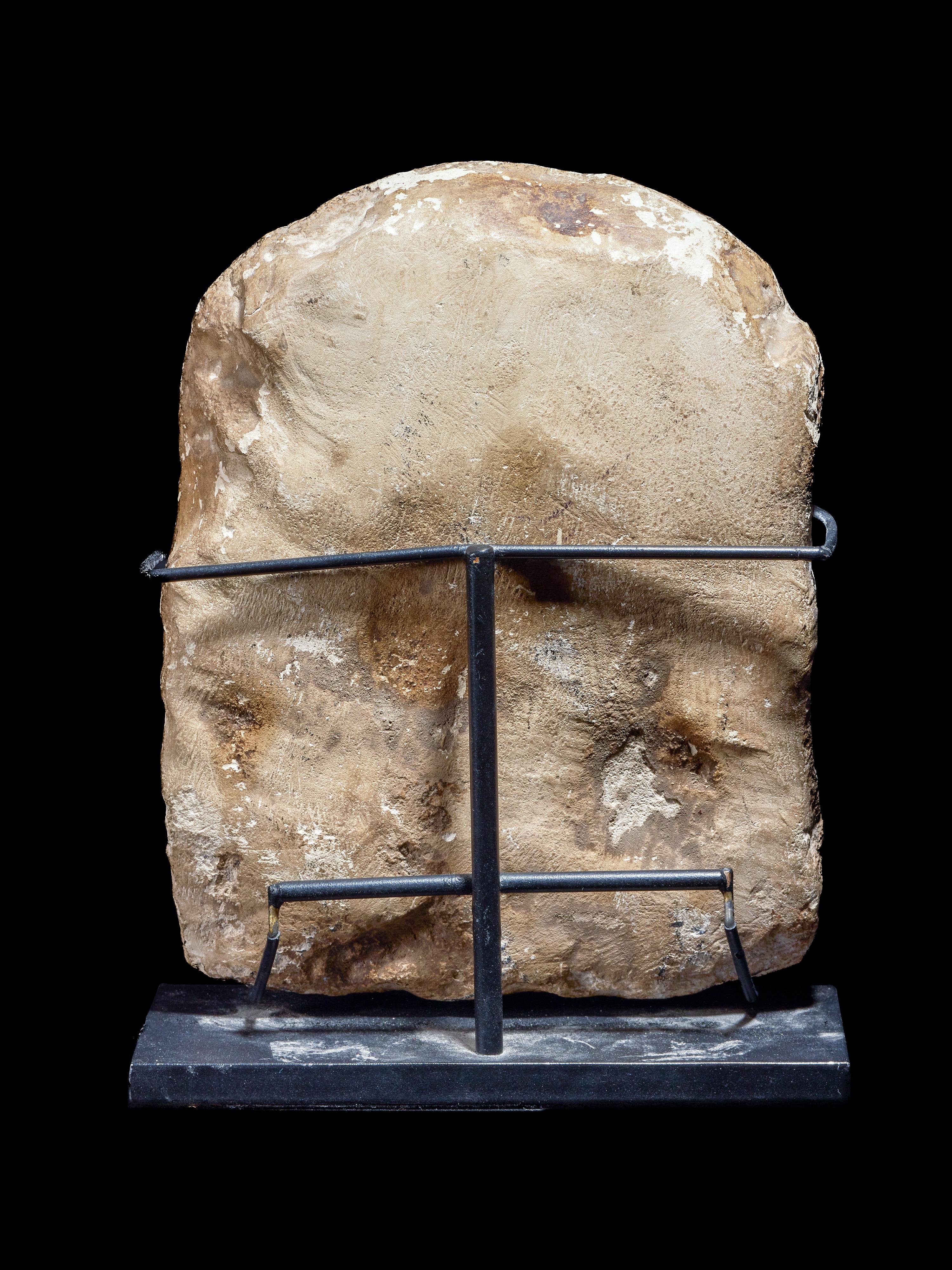 An Egyptian Limestone Round-Top Stele