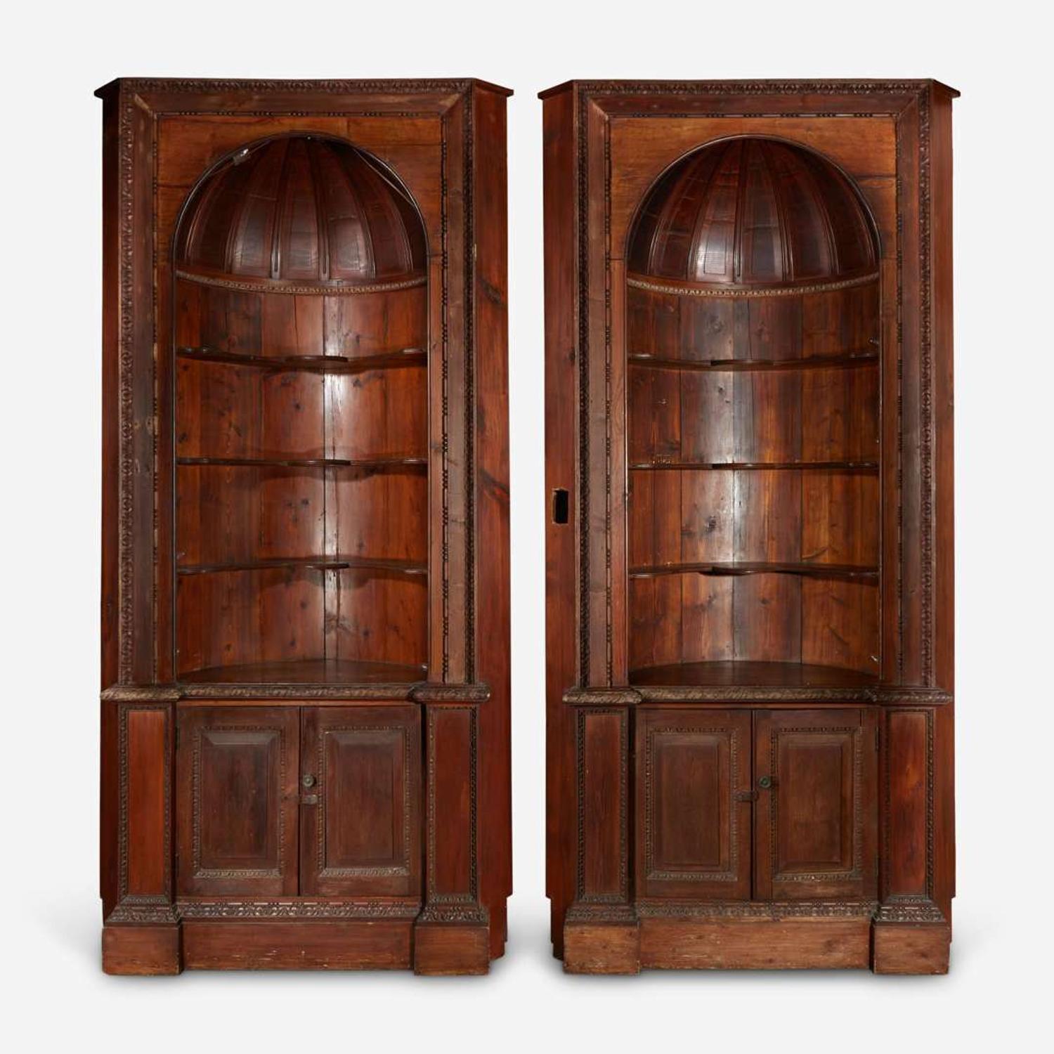 A Pair of George III Style Carved Pine Corner Cabinets late 19th/early 20th century, with later modifications