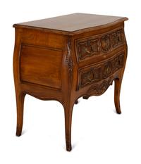 A Louis XV Provincial Style Carved Walnut Commode