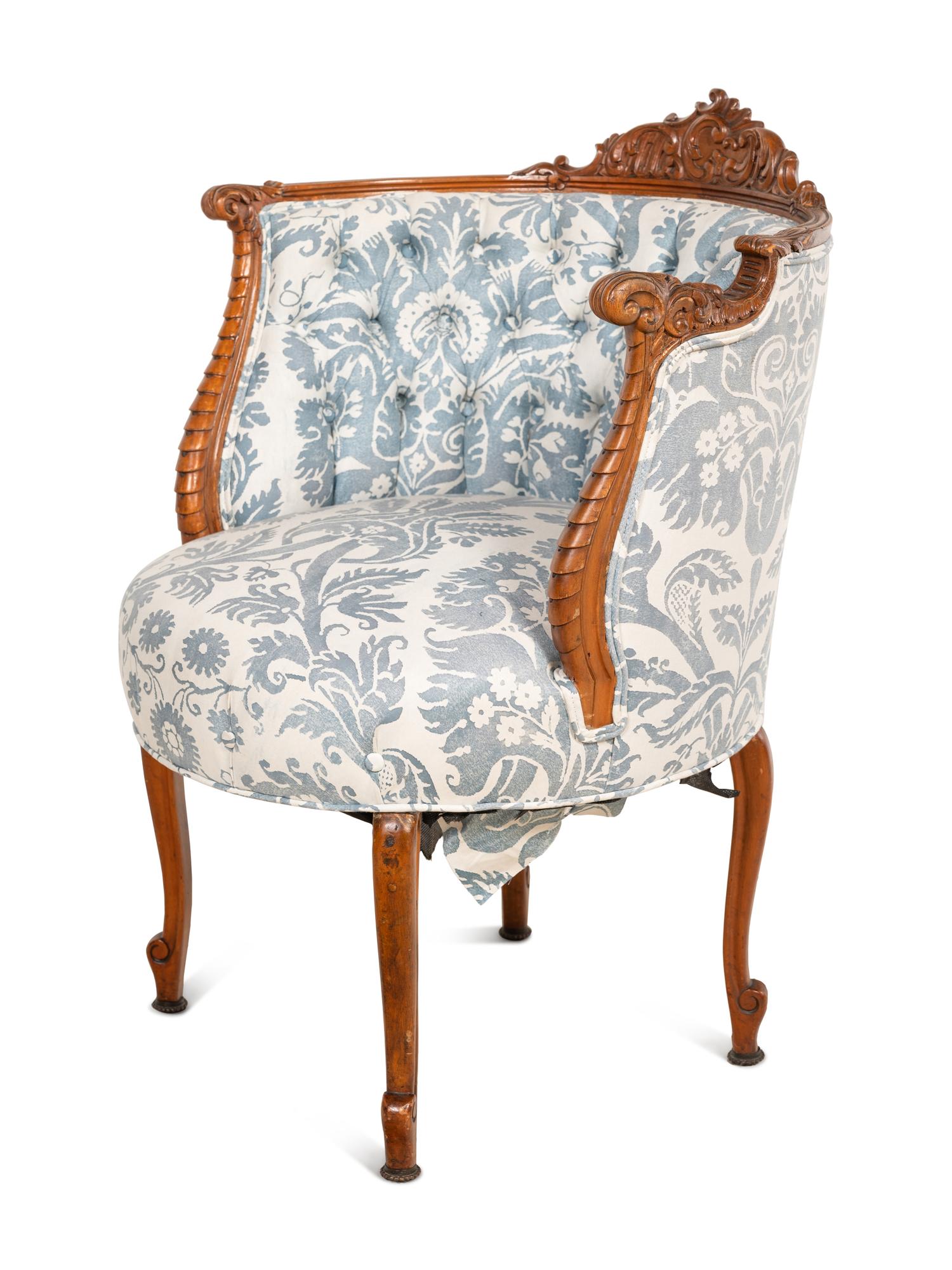 A Rococo Revival Carved Walnut Armchair