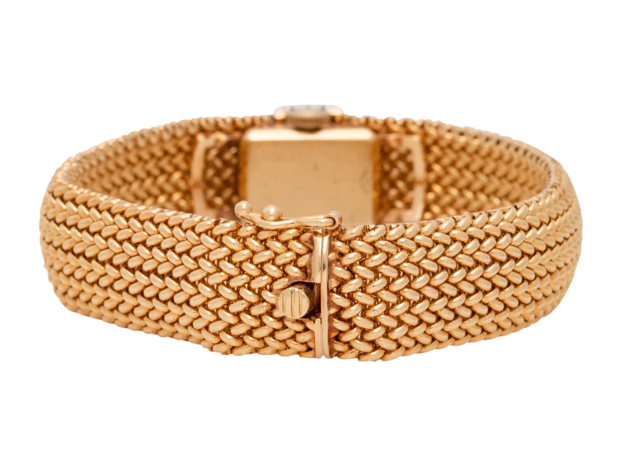 MOVADO, 14K YELLOW GOLD, DIAMOND AND SAPPHIRE SURPRISE WRISTWATCH
