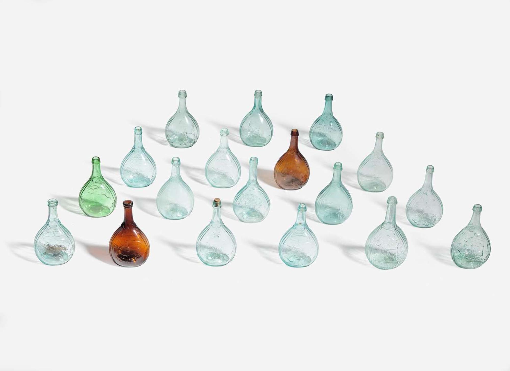 A collection of eighteen mold-blown colored glass calabash bottles, various makers, 19th century