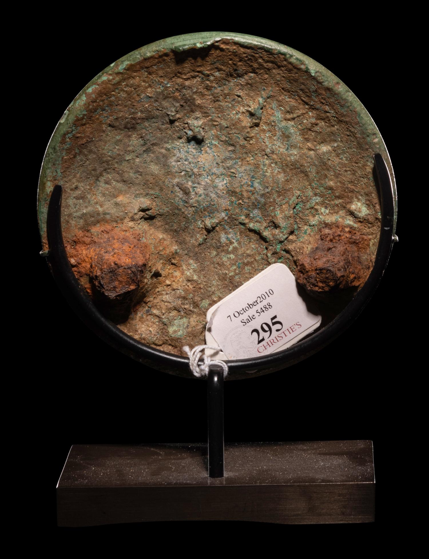 A Roman Silver and Bronze Boss with Erotes