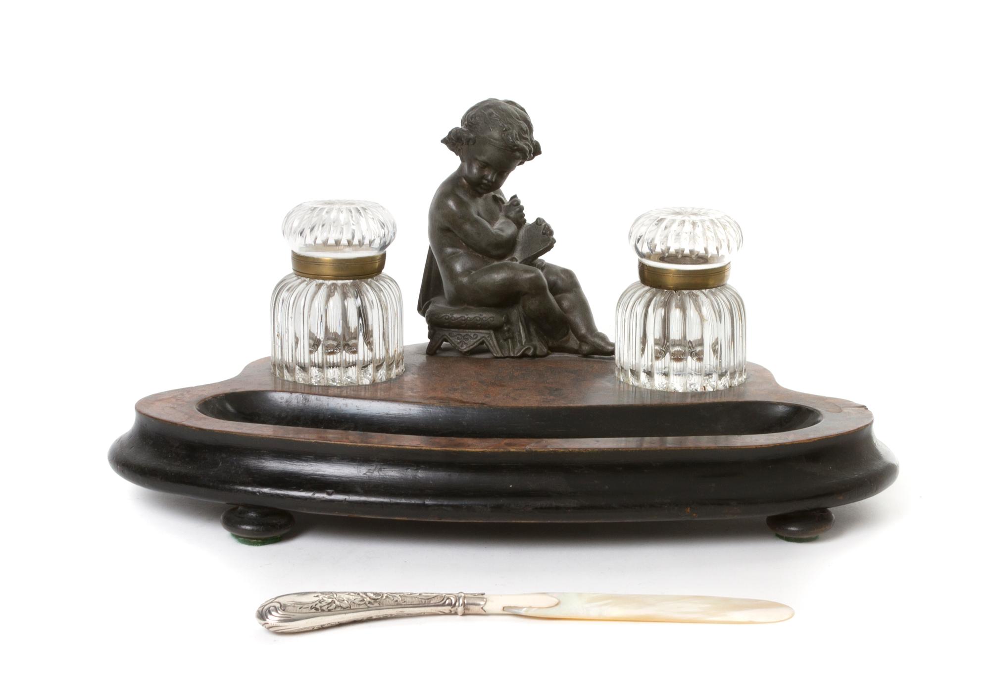 A Continental Cast Metal Figural Encrier, Width of first 14 inches.