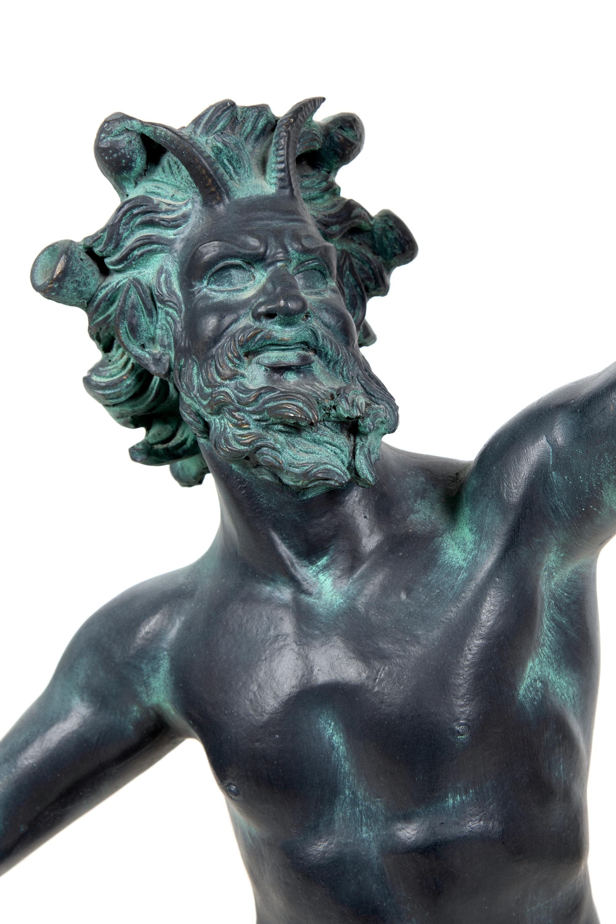 A Patinated Cast Resin Figure of the Faun of Pompeii