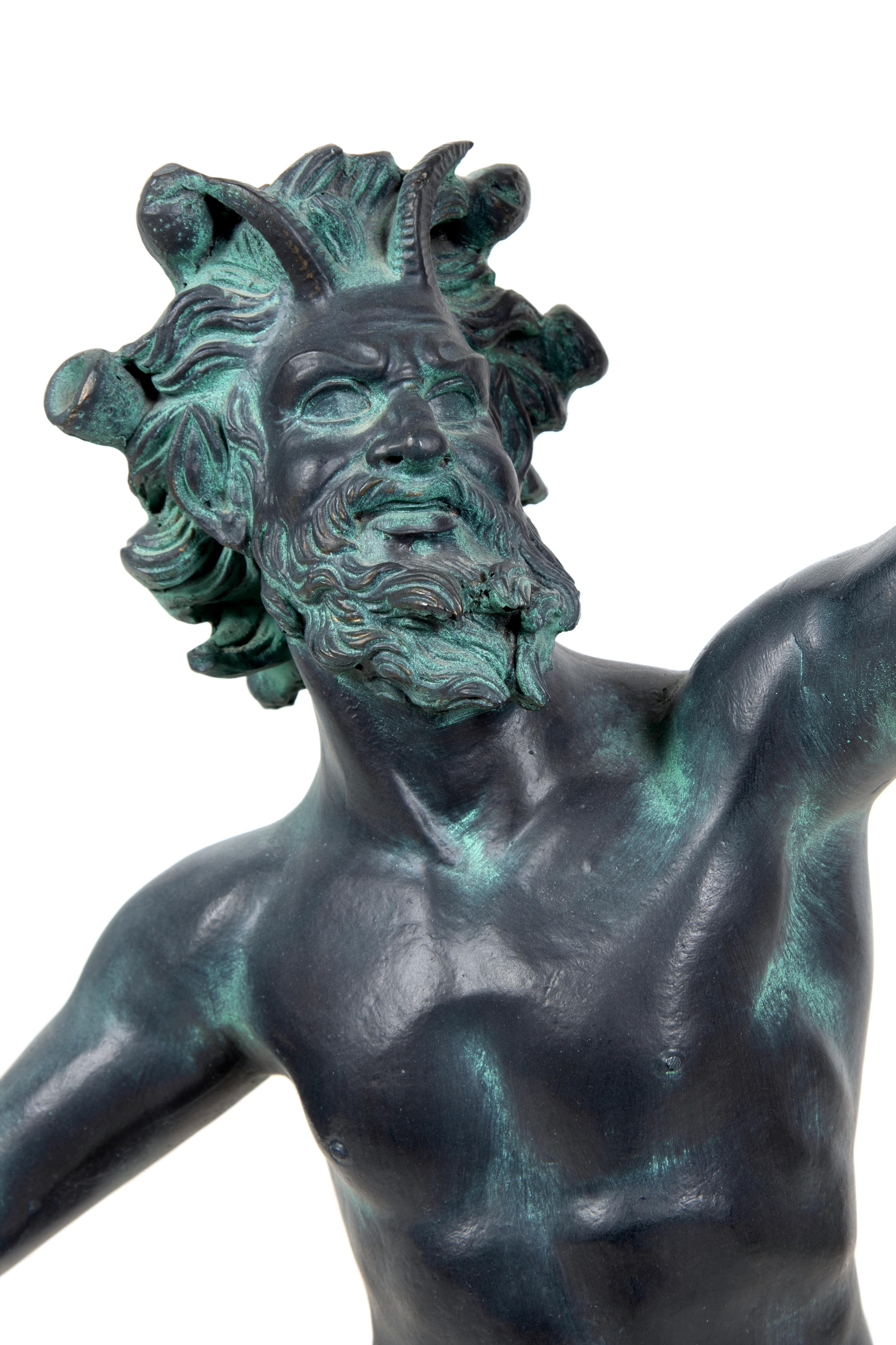A Patinated Cast Resin Figure of the Faun of Pompeii