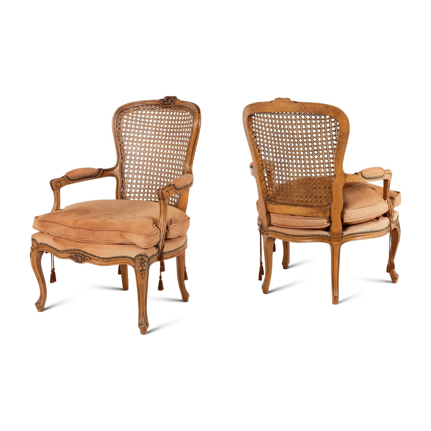 A Pair of Louis XV Style Nubuck Upholstered and Caned Fauteuils