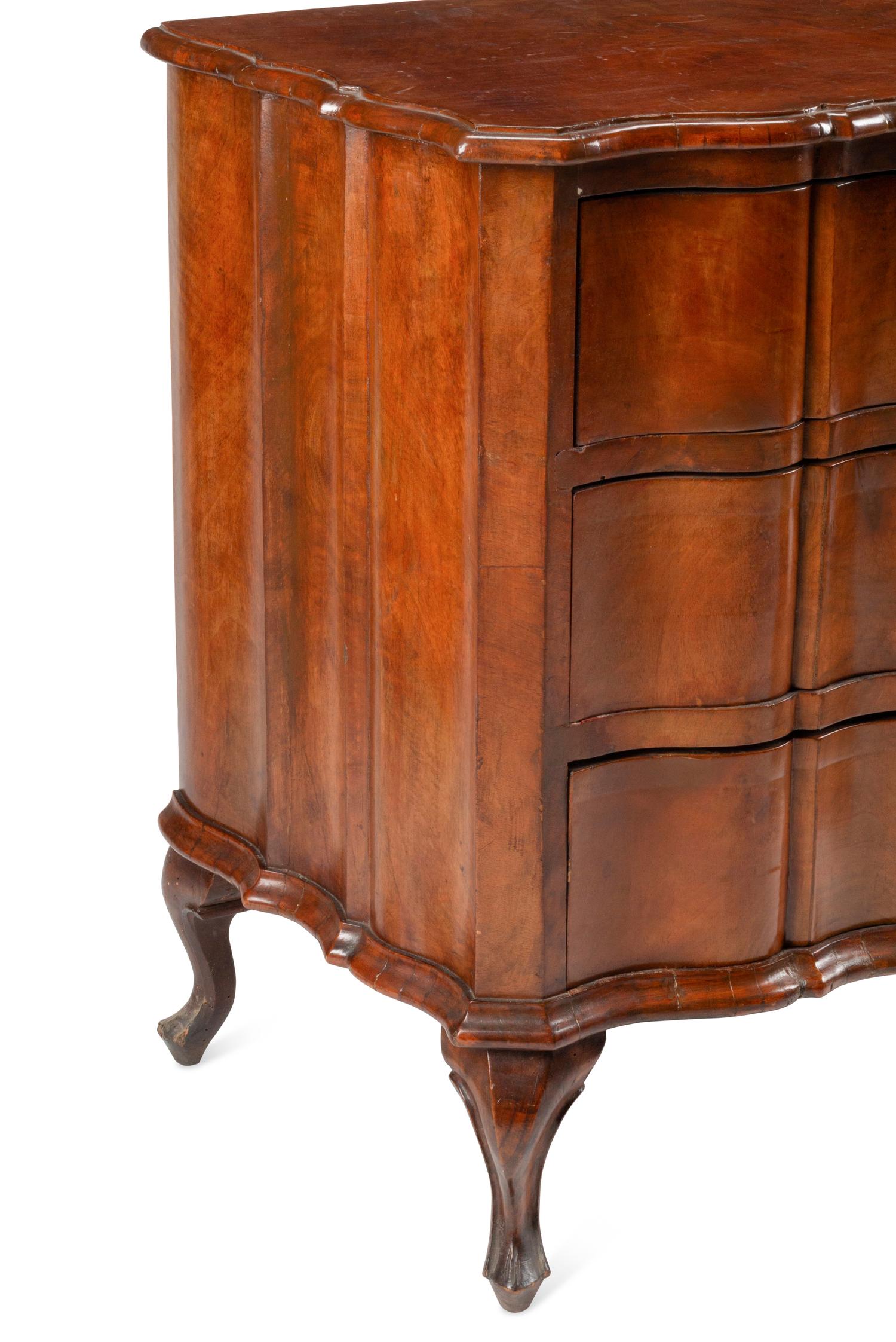 An Italian Walnut Three-Drawer Commode