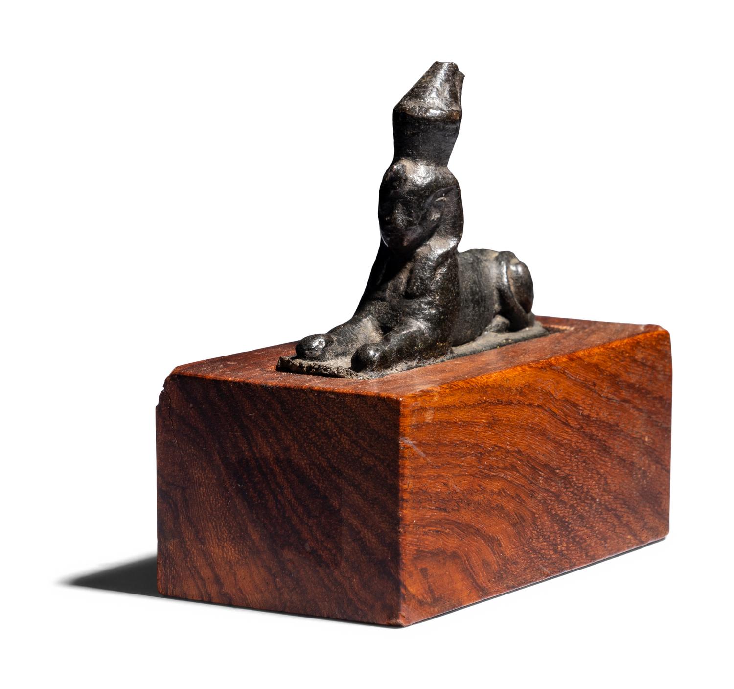 An Egyptian Bronze Sphinx