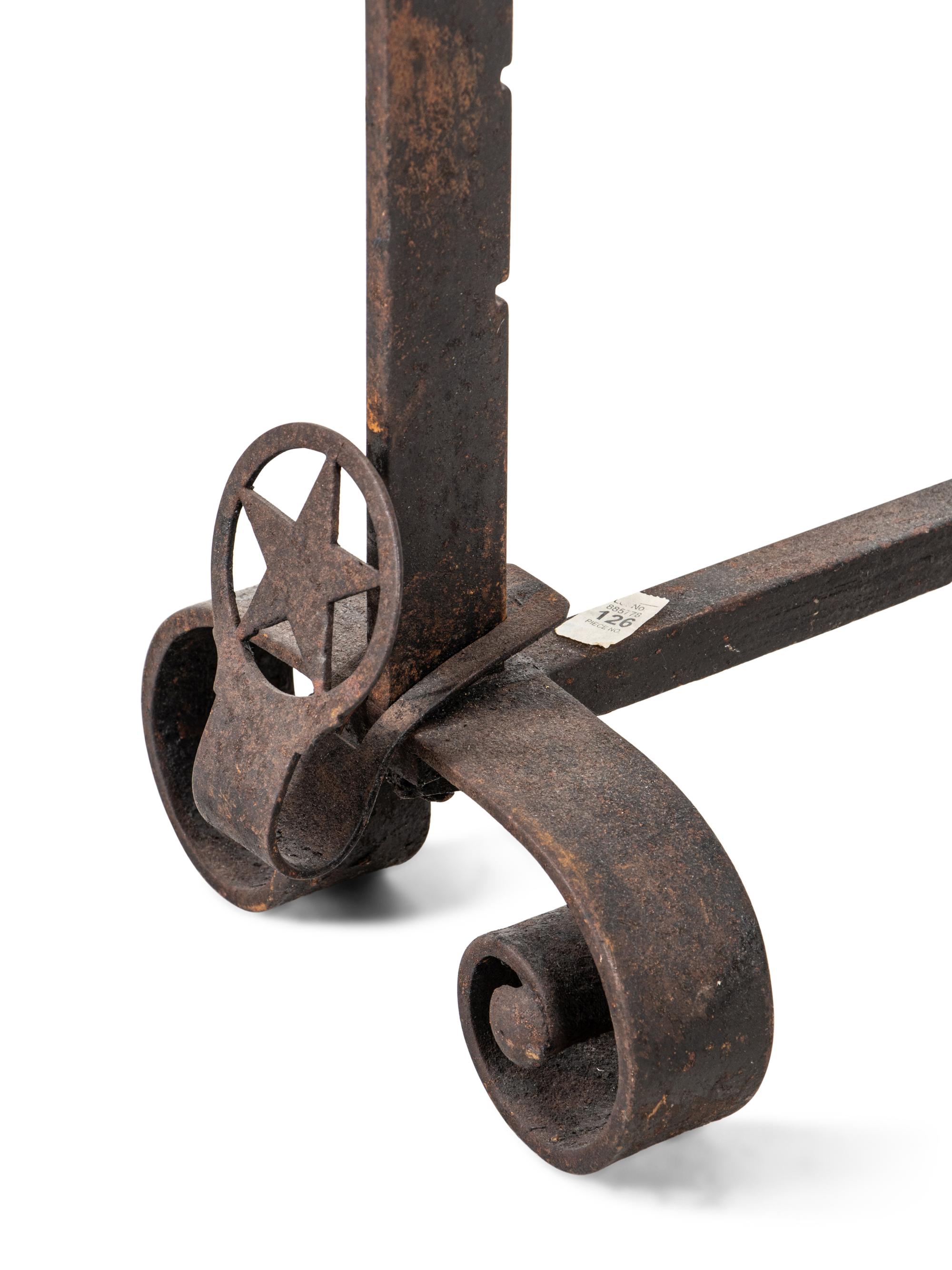A Pair of Iron Andirons with Star Ornaments