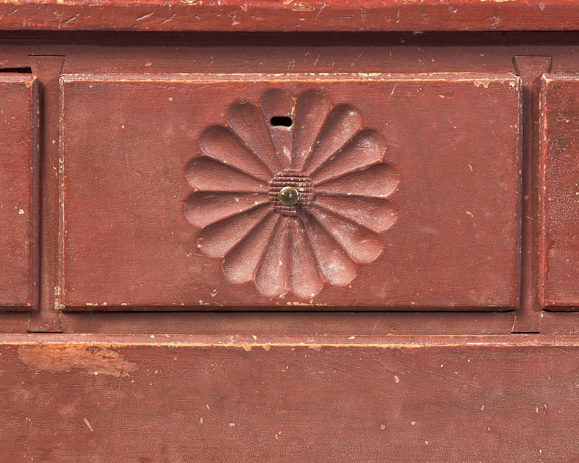 A Chippendale Carved And Red-Painted Chest Of Drawers