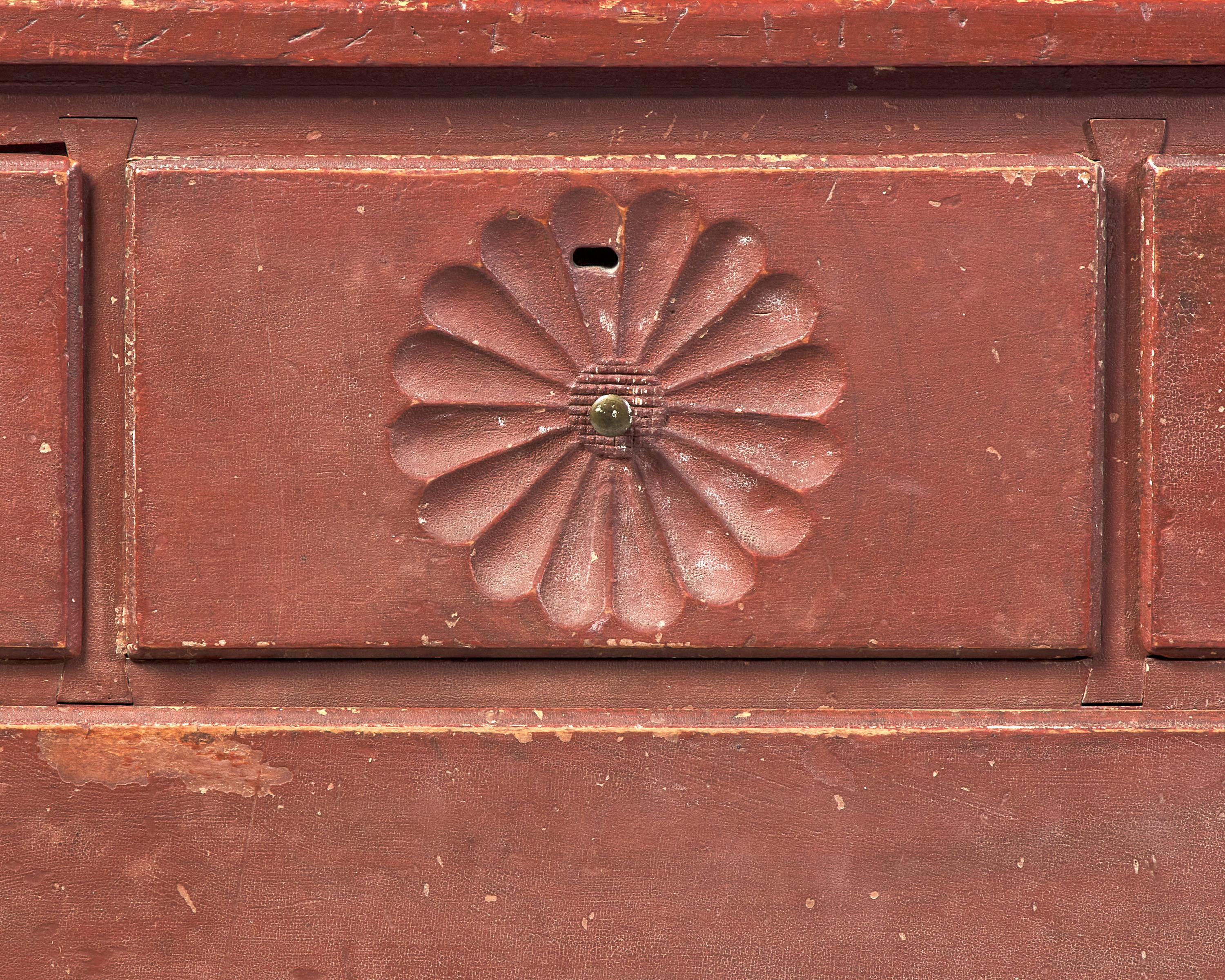 A Chippendale Carved And Red-Painted Chest Of Drawers