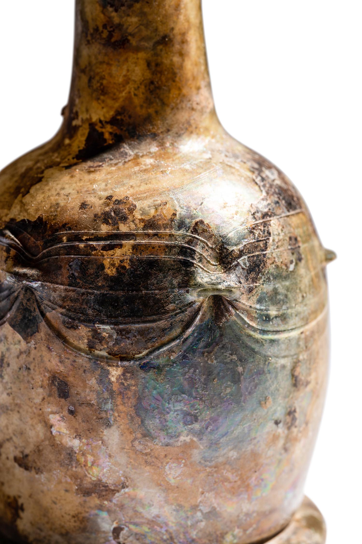 A Roman Glass Unguentarium with Six Knobs