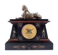 An Egyptian Revival Bronze Mounted and Parcel Gilt Mantel Clock