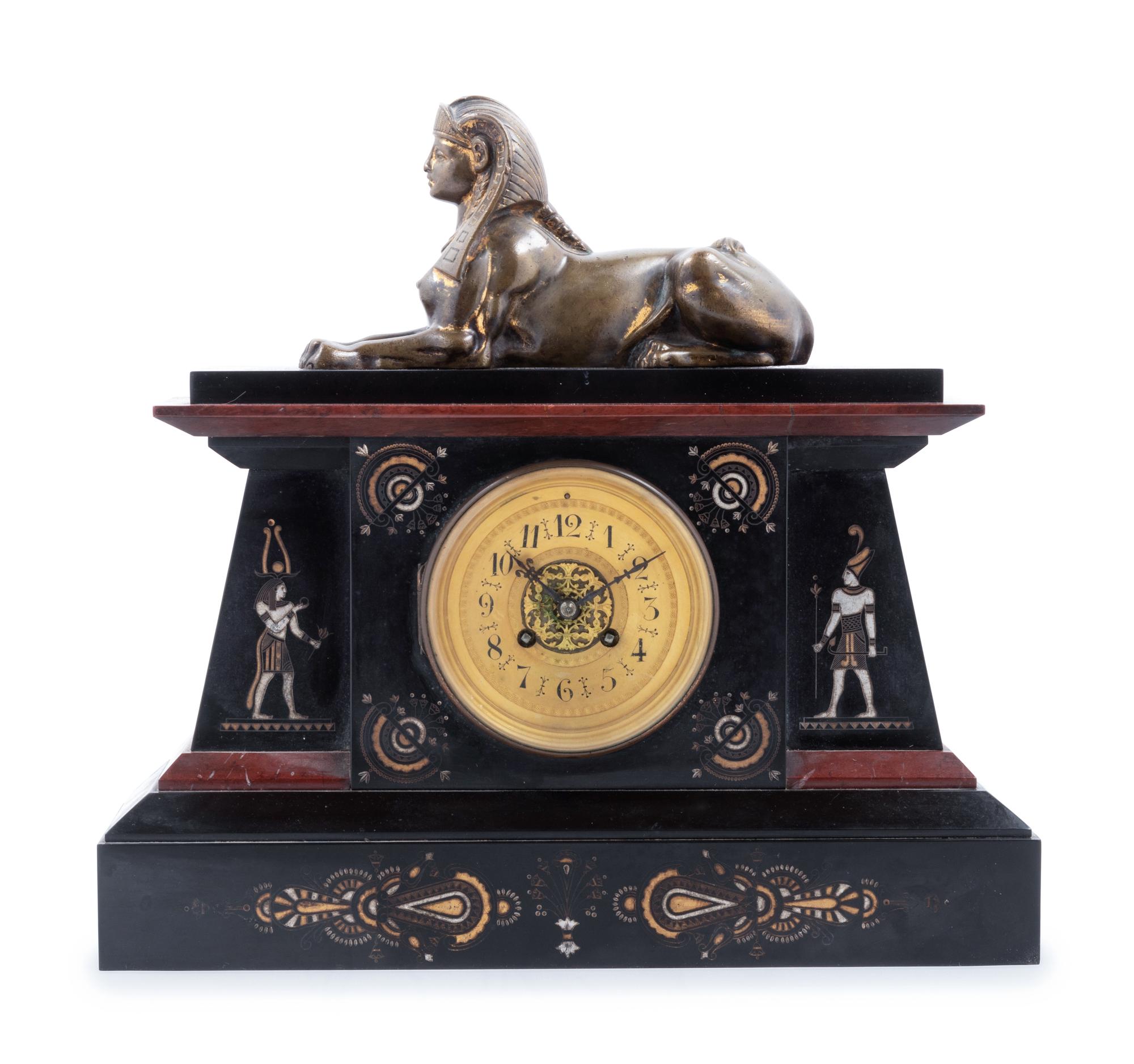 An Egyptian Revival Bronze Mounted and Parcel Gilt Mantel Clock
