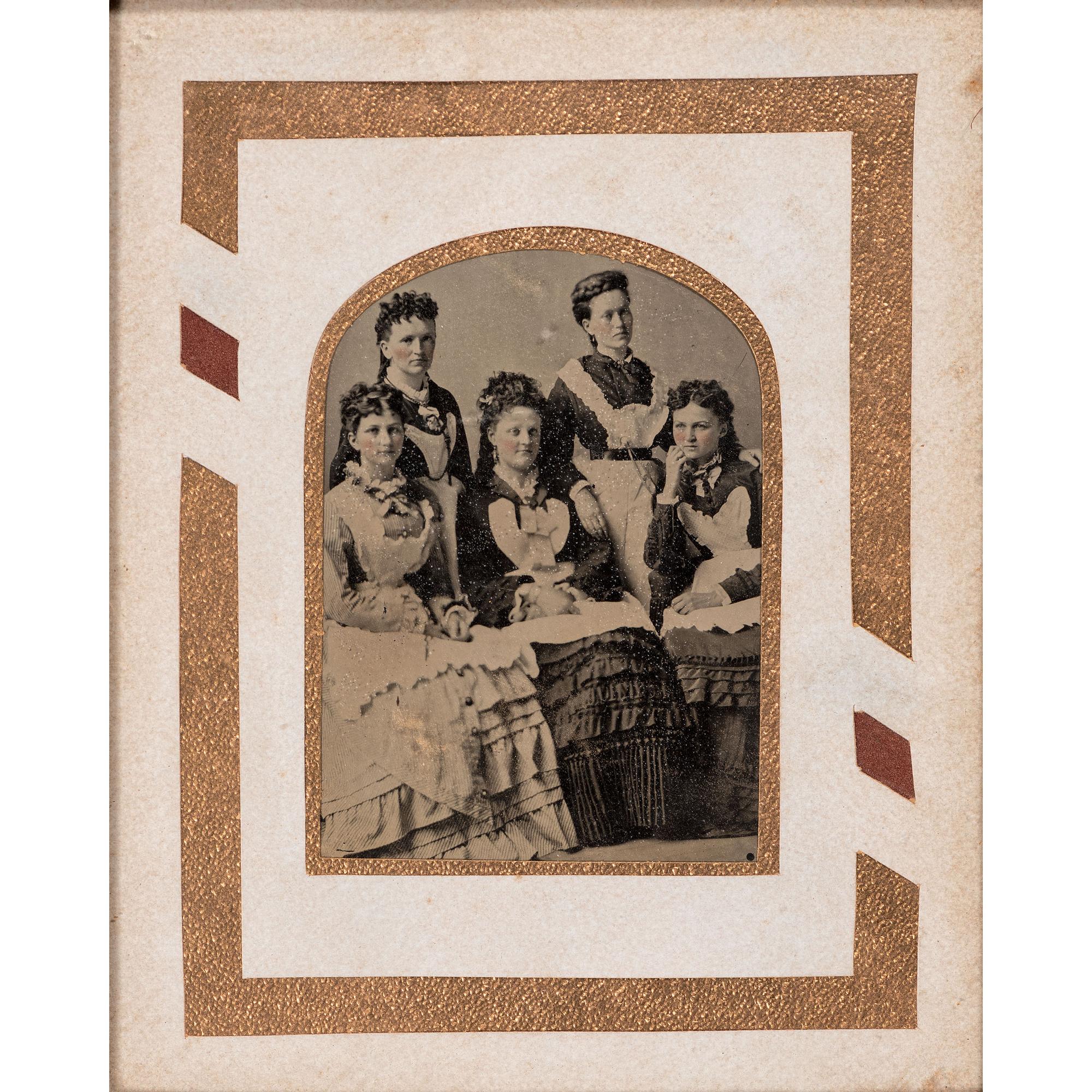 [EARLY PHOTOGRAPHY - PORTRAITURE]. A pair of framed tintypes of groups of people, comprising: