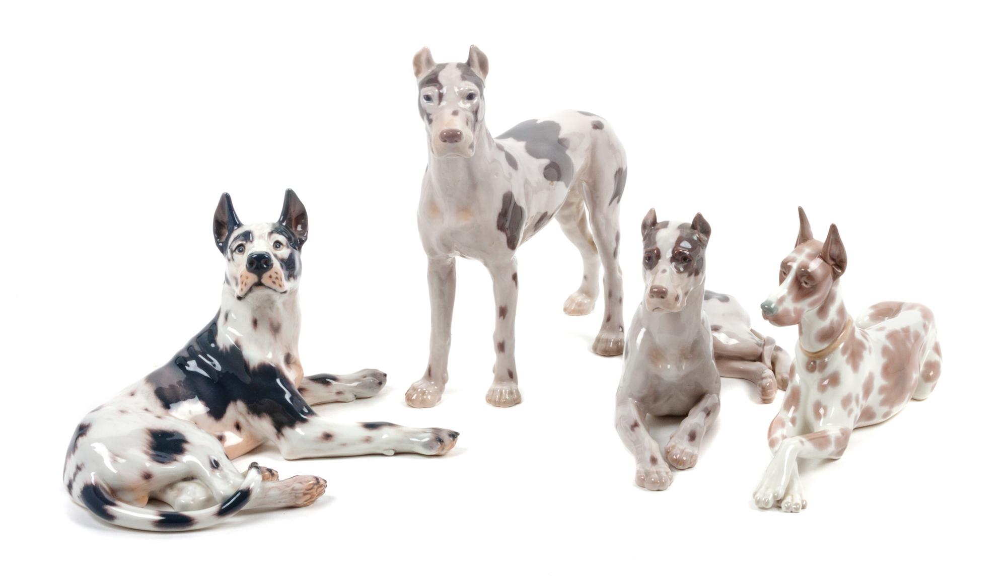 A Group of Four Porcelain Great Dane Figures Height of tallest 10 1/2 inches.