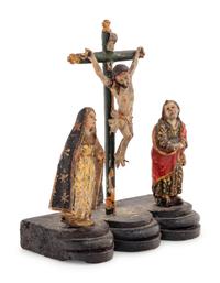 A Continental Carved and Polychrome Decorated Figural Group Depicting the Crucifixion