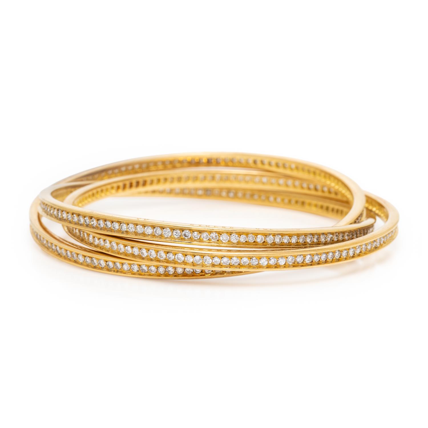CARTIER, YELLOW GOLD AND DIAMOND 'TRINITY' BANGLE BRACELET
