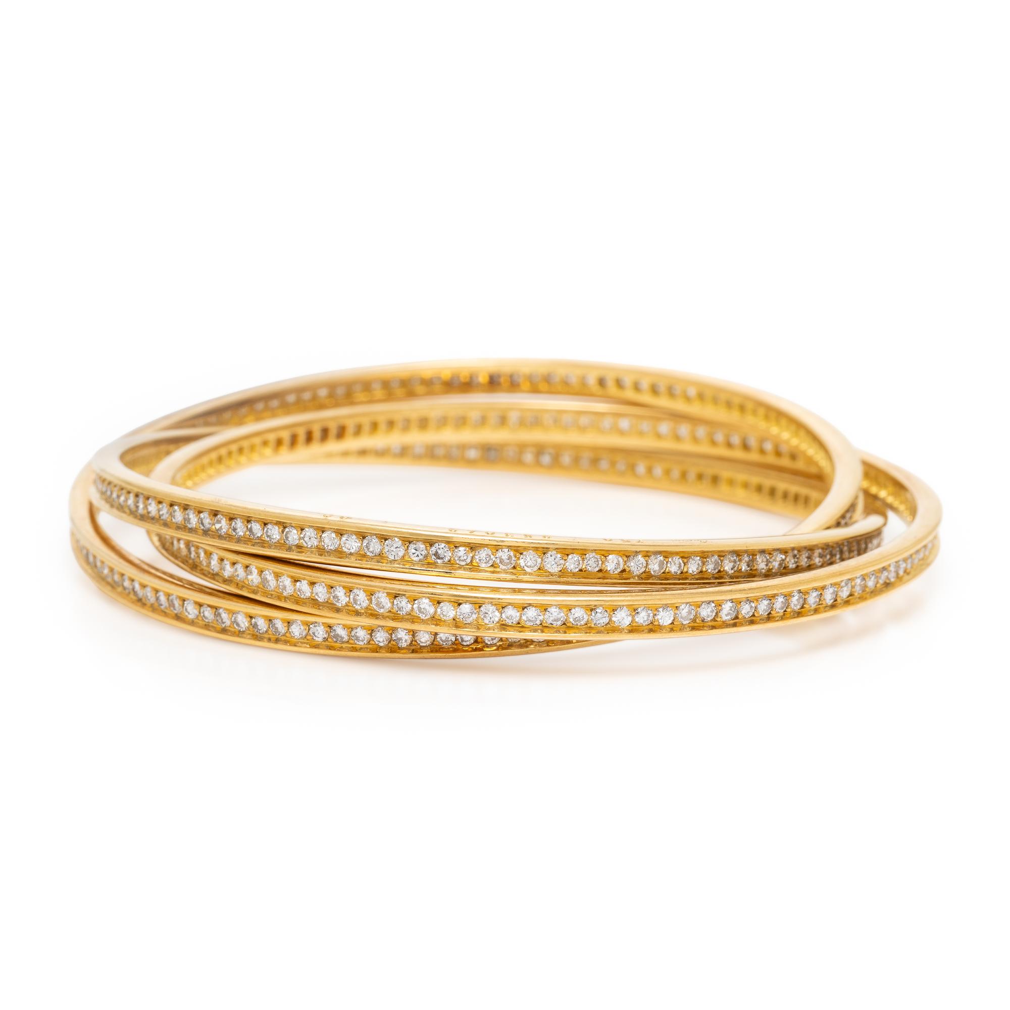 CARTIER, YELLOW GOLD AND DIAMOND 'TRINITY' BANGLE BRACELET
