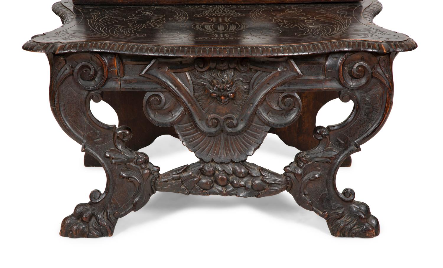 A Jacobean Style Carved Oak Bench with Armorial and Lion Carved Back