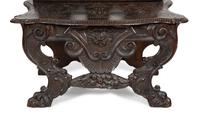 A Jacobean Style Carved Oak Bench with Armorial and Lion Carved Back