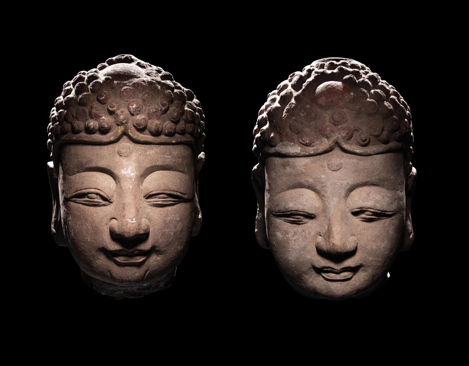 A Pair of Chinese Carved Stone Heads of Buddha