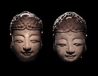 A Pair of Chinese Carved Stone Heads of Buddha