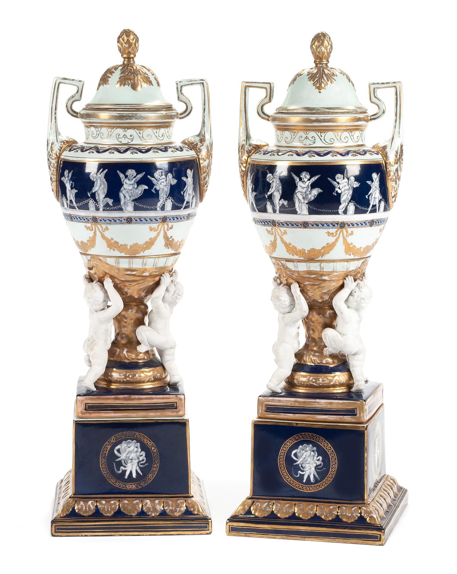 A Pair of Minton Style Porcelain and Bisque Covered Urns Height 28 1/2 inches.