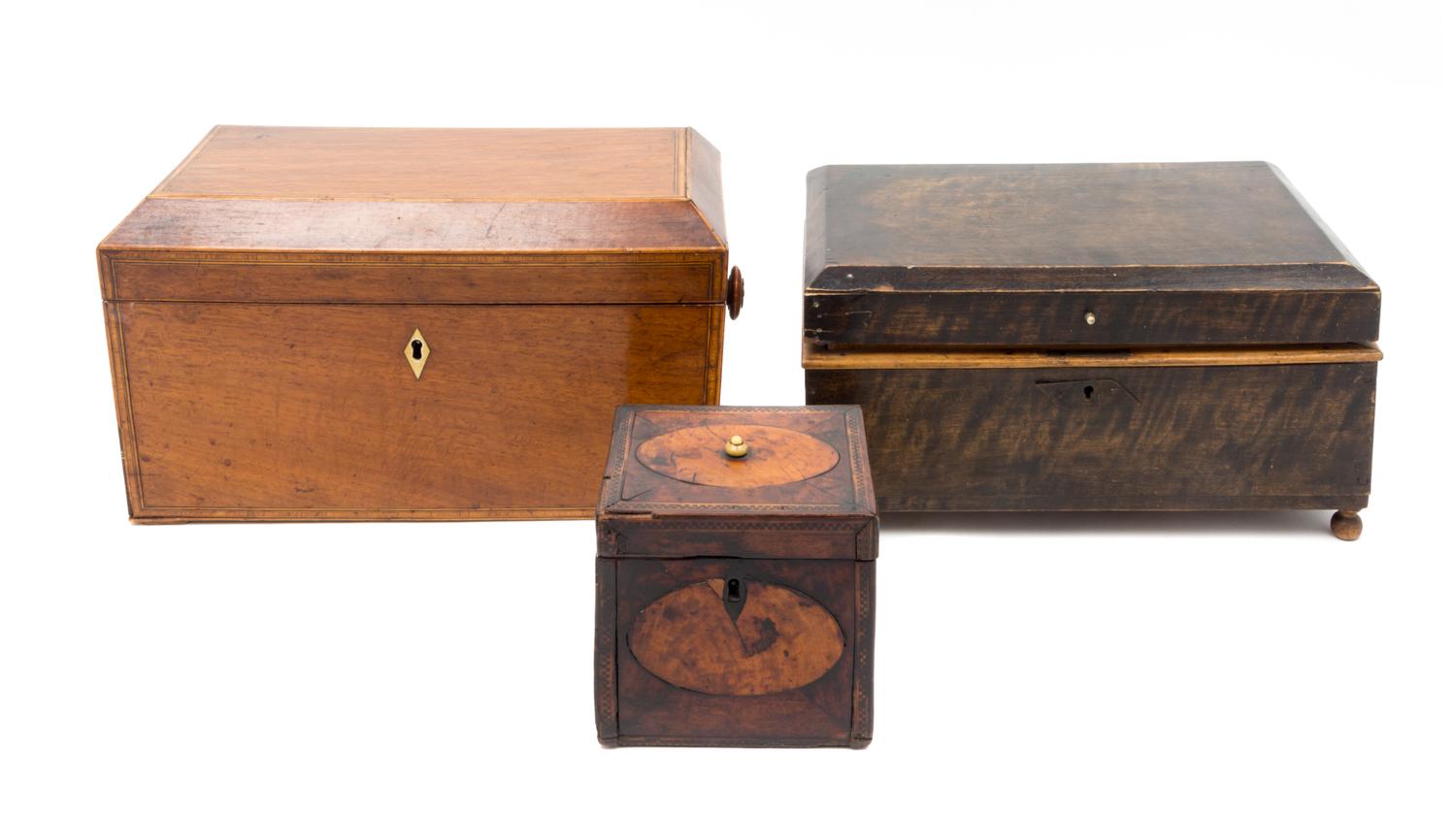 Three Wood Tea Caddies Height of largest 6 1/2 x length 12 x depth 6 1/4 inches.