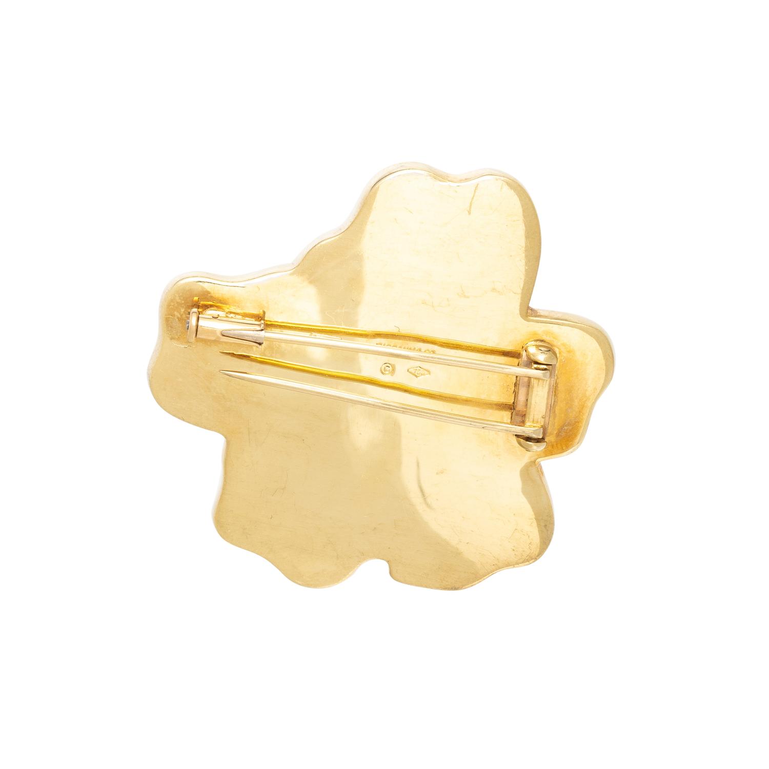 TIFFANY & CO., ANGELA CUMMINGS, YELLOW GOLD, CORAL, AND ONYX STARFISH BROOCH