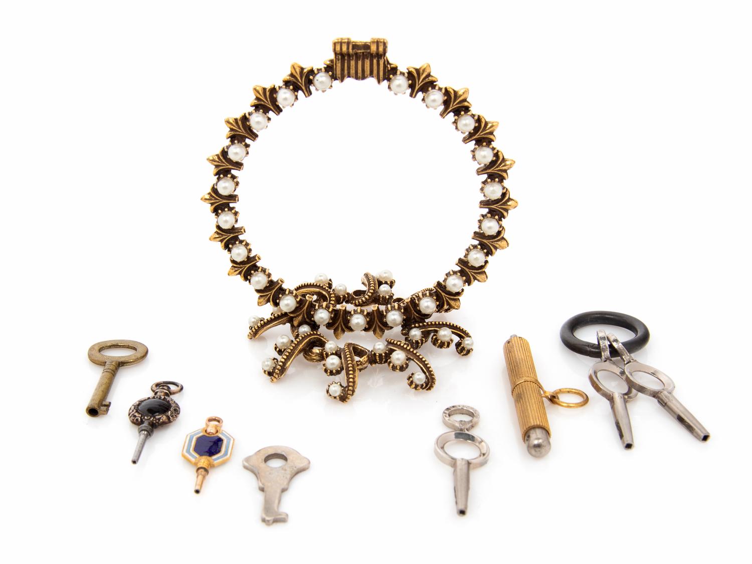 Two Antique Pocket Watch Keys and a Metal and Faux Pearl Watch Stand