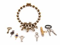 Two Antique Pocket Watch Keys and a Metal and Faux Pearl Watch Stand