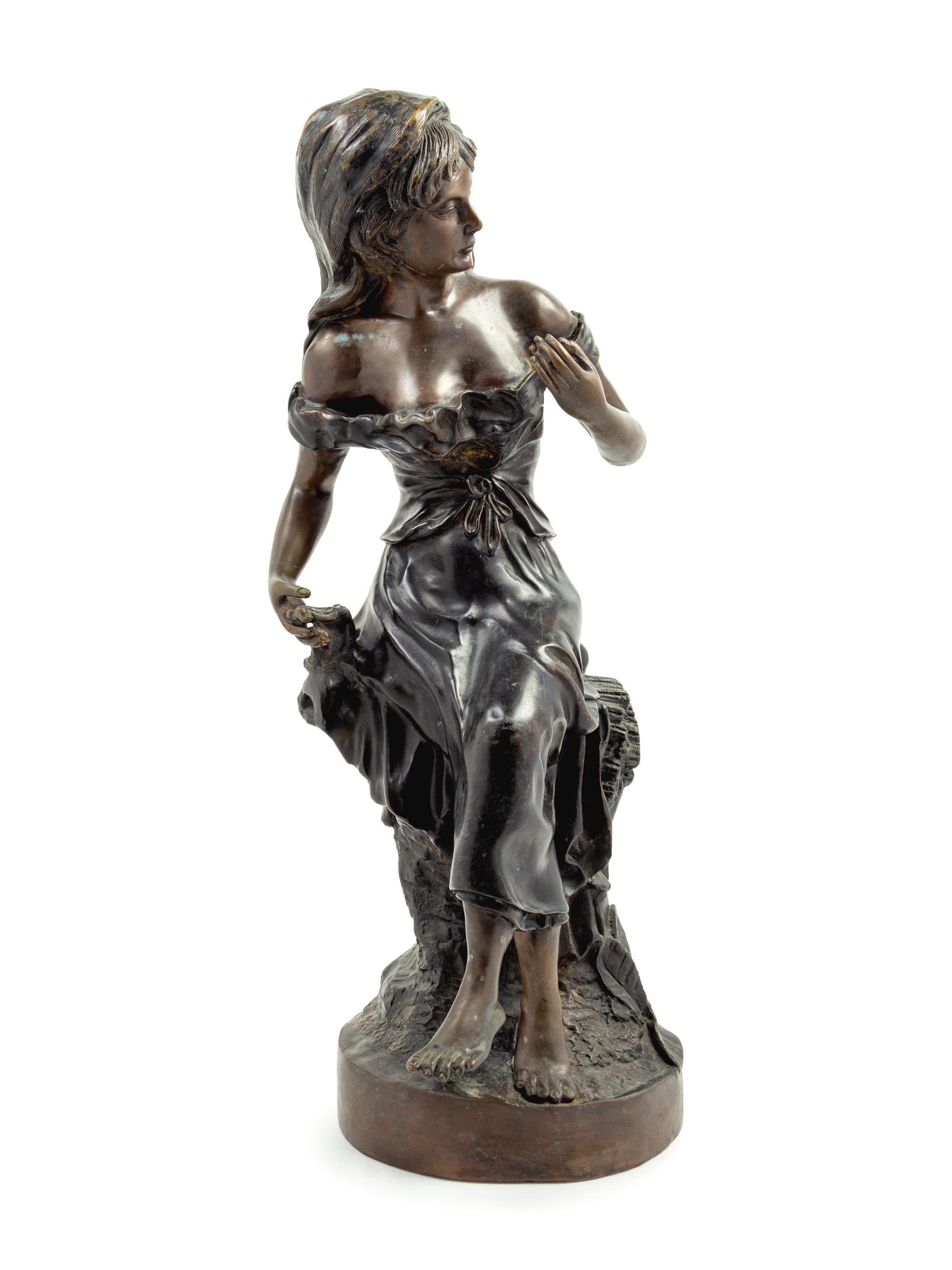 A Cast Metal Figure of A Woman