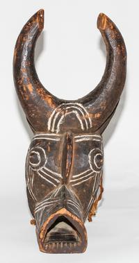 A Bobo White Pigmented Buffalo Mask. Height 18 inches.