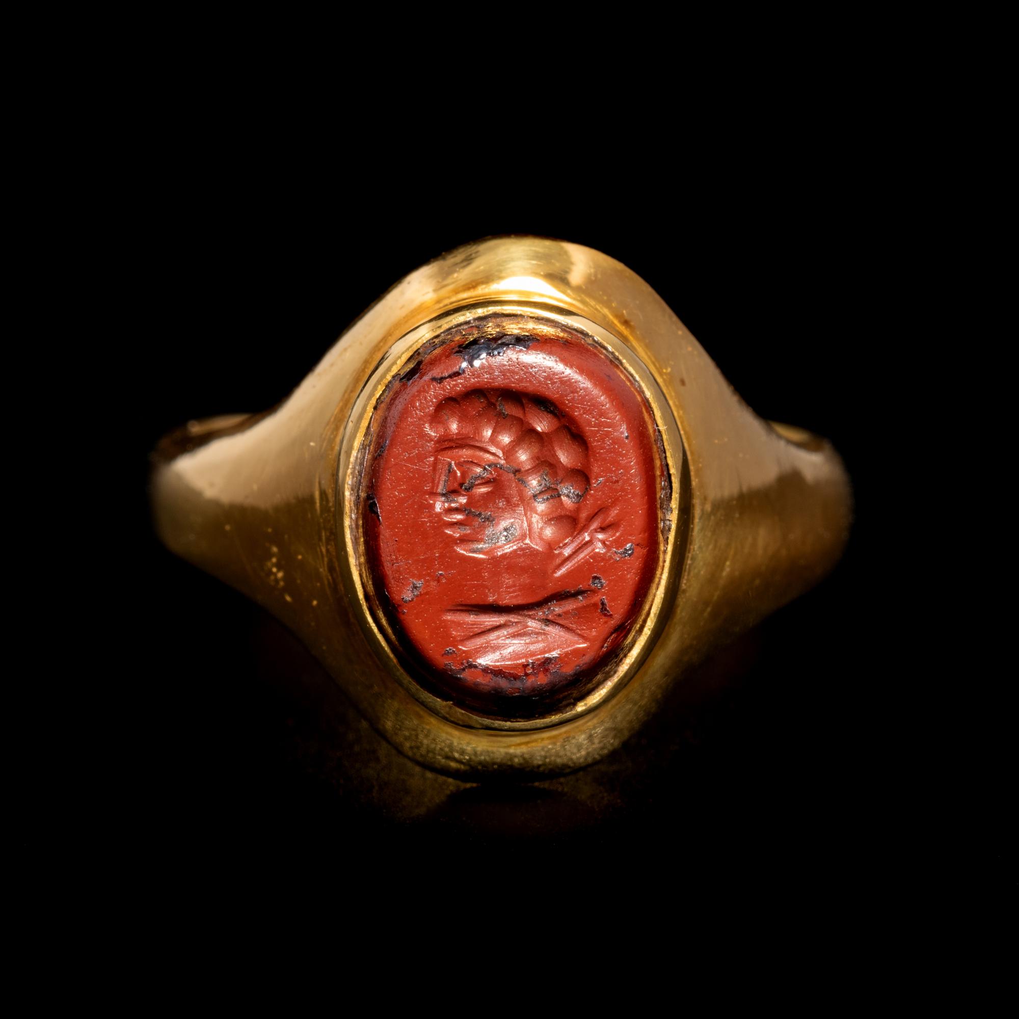 A Roman Gold and Red Jasper Finger Ring Engraved with the Bust of a Man