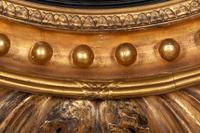 A Regency Carved Giltwood Convex Girandole Mirror by Thomas Fentham