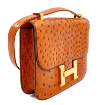 An Hermès Cognac Ostrich Constance Bag, 7" H x 9" W x 2" D; Strap drop: 14" or 8.5".